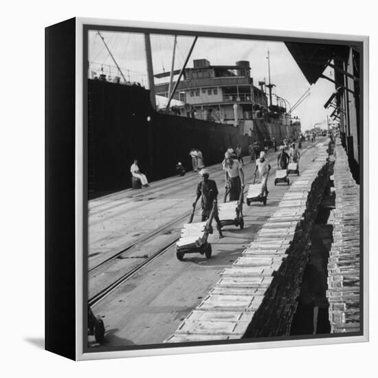 Tin Ingots Being Stacked Along the Penang Docks-Carl Mydans-Framed Premier Image Canvas