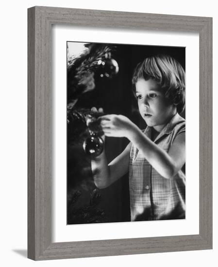 Tina Smith Decorating a Christmas Tree at Guantanamo Naval Base Where Her Dad Is Stationed-John Dominis-Framed Photographic Print