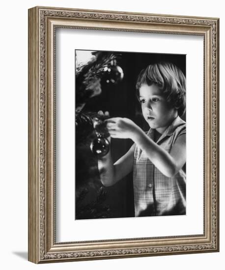 Tina Smith Decorating a Christmas Tree at Guantanamo Naval Base Where Her Dad Is Stationed-John Dominis-Framed Photographic Print