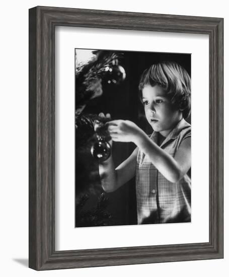 Tina Smith Decorating a Christmas Tree at Guantanamo Naval Base Where Her Dad Is Stationed-John Dominis-Framed Photographic Print