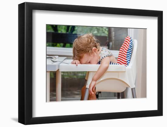 Tired Child Sleeping in Highchair after the Lunch. Baby over Eating and Fall Asleep Just after Feed-Alina R-Framed Photographic Print