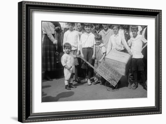 Toddler Holds a Small Soap Box Derby Vehicle-null-Framed Art Print