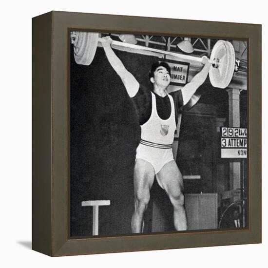 Tommy Kono Winning the Gold Medal for Men's Weightlifting at the 1956 Melbourne Olympics-null-Framed Premier Image Canvas