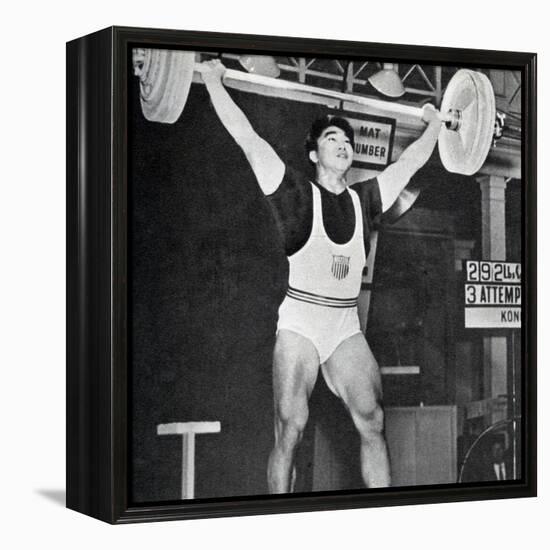 Tommy Kono Winning the Gold Medal for Men's Weightlifting at the 1956 Melbourne Olympics-null-Framed Premier Image Canvas