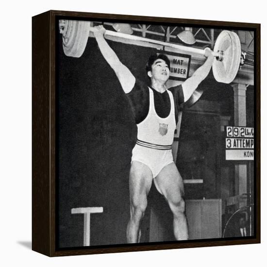 Tommy Kono Winning the Gold Medal for Men's Weightlifting at the 1956 Melbourne Olympics-null-Framed Premier Image Canvas