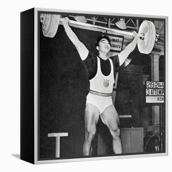 Tommy Kono Winning the Gold Medal for Men's Weightlifting at the 1956 Melbourne Olympics-null-Framed Premier Image Canvas