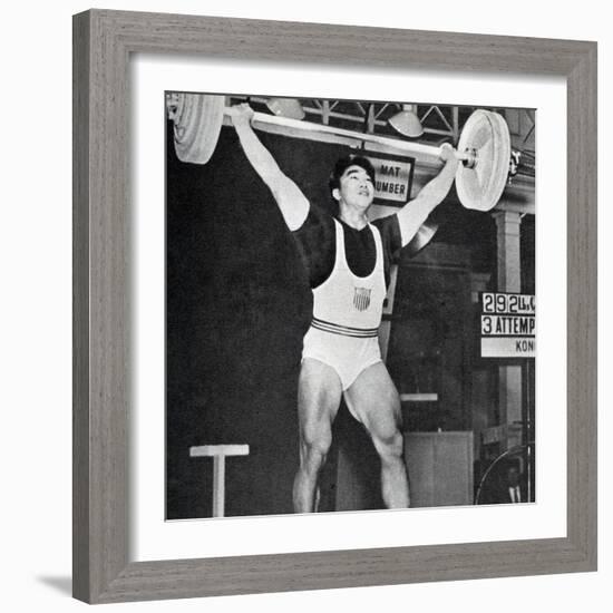 Tommy Kono Winning the Gold Medal for Men's Weightlifting at the 1956 Melbourne Olympics-null-Framed Photographic Print