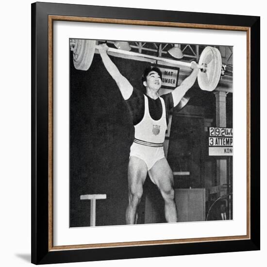 Tommy Kono Winning the Gold Medal for Men's Weightlifting at the 1956 Melbourne Olympics-null-Framed Photographic Print