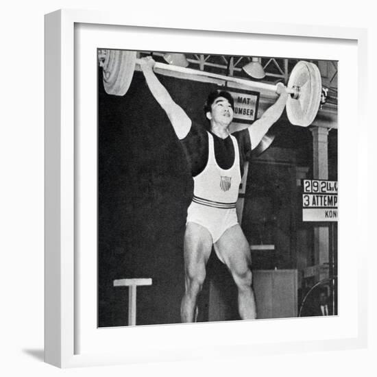 Tommy Kono Winning the Gold Medal for Men's Weightlifting at the 1956 Melbourne Olympics-null-Framed Photographic Print