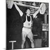 Tommy Kono Winning the Gold Medal for Men's Weightlifting at the 1956 Melbourne Olympics-null-Mounted Photographic Print