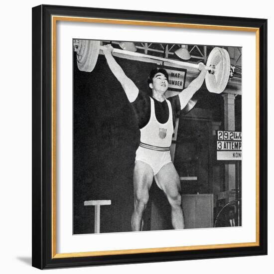 Tommy Kono Winning the Gold Medal for Men's Weightlifting at the 1956 Melbourne Olympics-null-Framed Photographic Print