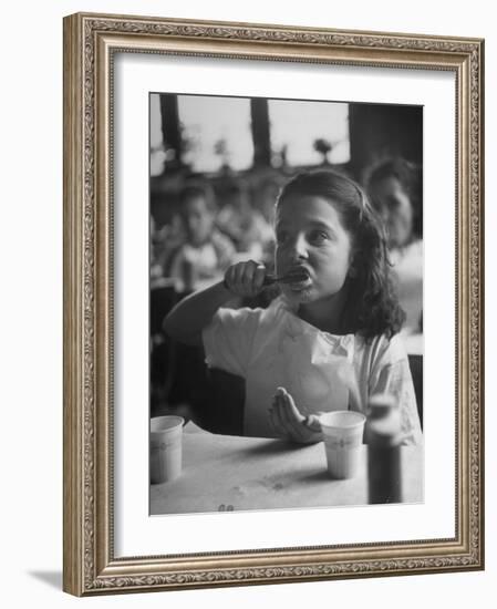 Tooth Powder Being Tested by Schoolgirl in Classroom-Yale Joel-Framed Photographic Print