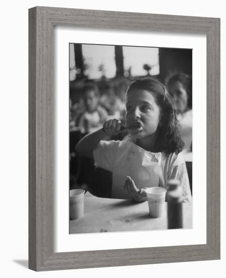 Tooth Powder Being Tested by Schoolgirl in Classroom-Yale Joel-Framed Photographic Print