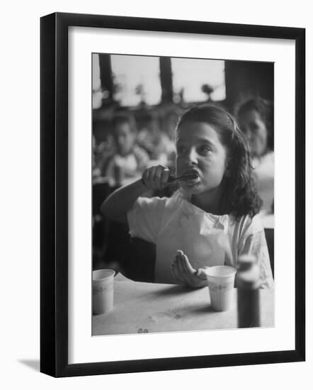 Tooth Powder Being Tested by Schoolgirl in Classroom-Yale Joel-Framed Photographic Print