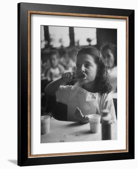 Tooth Powder Being Tested by Schoolgirl in Classroom-Yale Joel-Framed Photographic Print