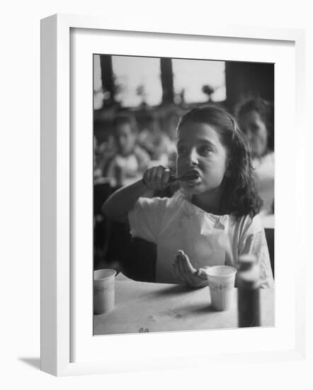 Tooth Powder Being Tested by Schoolgirl in Classroom-Yale Joel-Framed Photographic Print