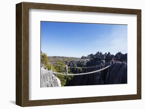 Tourist crossing a rope bridge, Grand Tsingy, Tsingy du Bemaraha National Park, UNESCO World Herita-Christian Kober-Framed Photographic Print