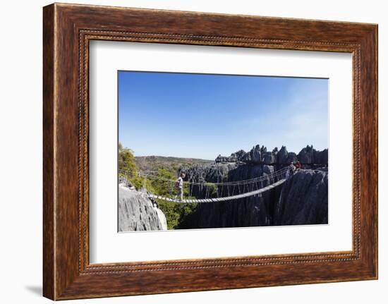 Tourist crossing a rope bridge, Grand Tsingy, Tsingy du Bemaraha National Park, UNESCO World Herita-Christian Kober-Framed Photographic Print