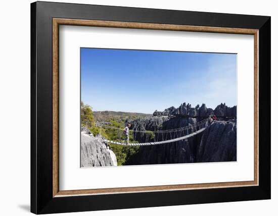 Tourist crossing a rope bridge, Grand Tsingy, Tsingy du Bemaraha National Park, UNESCO World Herita-Christian Kober-Framed Photographic Print