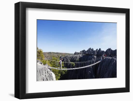 Tourist crossing a rope bridge, Grand Tsingy, Tsingy du Bemaraha National Park, UNESCO World Herita-Christian Kober-Framed Photographic Print