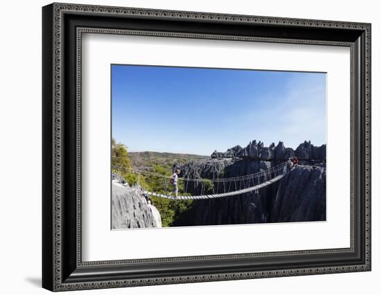 Tourist crossing a rope bridge, Grand Tsingy, Tsingy du Bemaraha National Park, UNESCO World Herita-Christian Kober-Framed Photographic Print