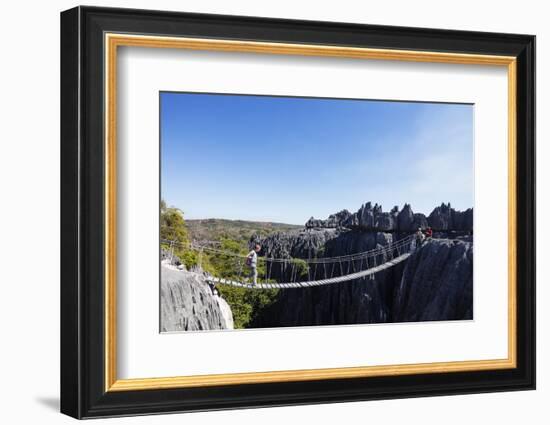 Tourist crossing a rope bridge, Grand Tsingy, Tsingy du Bemaraha National Park, UNESCO World Herita-Christian Kober-Framed Photographic Print