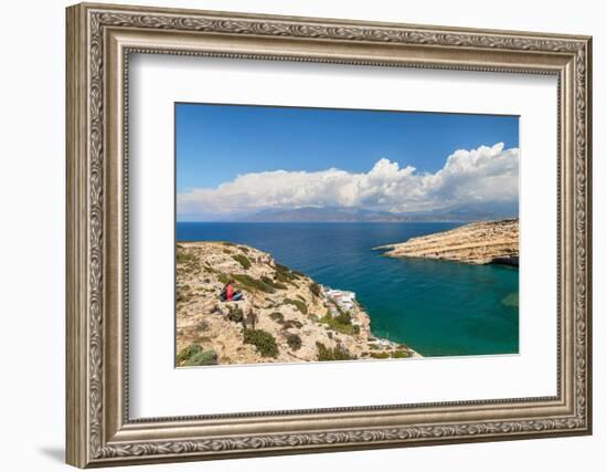 Tourist enjoying the view of the bay of Matala, Iraklion, Crete, Greek Islands, Greece, Europe-Markus Lange-Framed Photographic Print