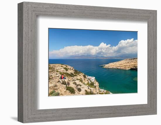 Tourist enjoying the view of the bay of Matala, Iraklion, Crete, Greek Islands, Greece, Europe-Markus Lange-Framed Photographic Print