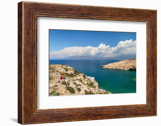 Tourist enjoying the view of the bay of Matala, Iraklion, Crete, Greek Islands, Greece, Europe-Markus Lange-Framed Photographic Print