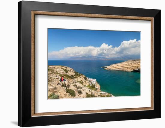 Tourist enjoying the view of the bay of Matala, Iraklion, Crete, Greek Islands, Greece, Europe-Markus Lange-Framed Photographic Print