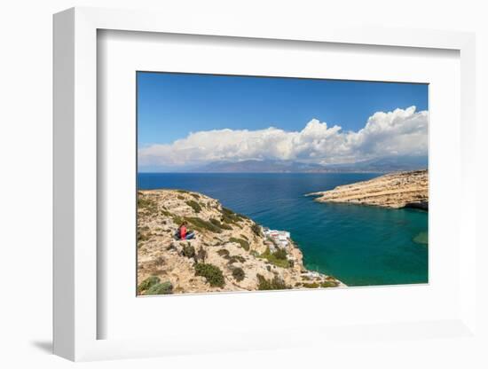 Tourist enjoying the view of the bay of Matala, Iraklion, Crete, Greek Islands, Greece, Europe-Markus Lange-Framed Photographic Print