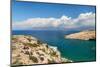 Tourist enjoying the view of the bay of Matala, Iraklion, Crete, Greek Islands, Greece, Europe-Markus Lange-Mounted Photographic Print