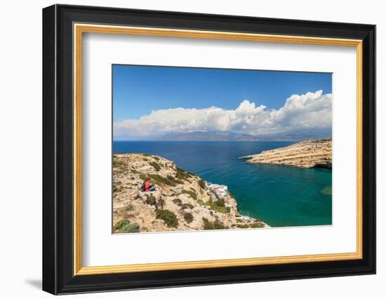 Tourist enjoying the view of the bay of Matala, Iraklion, Crete, Greek Islands, Greece, Europe-Markus Lange-Framed Photographic Print