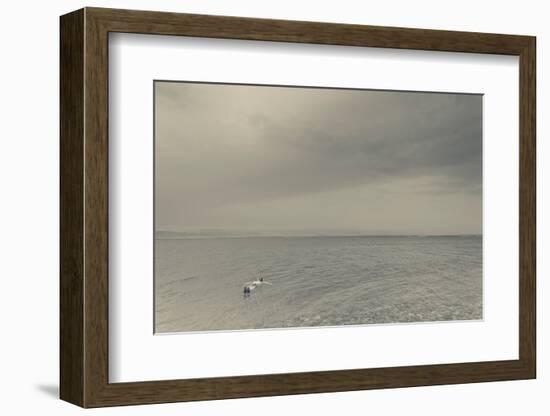 Tourist floating on water on the beach by the Dead Sea, Suweimah, Jordan-null-Framed Photographic Print