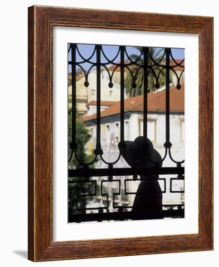 Tourist Gazes at Historic House through Iron Grillwork of Church, Lisbon, Portugal-Merrill Images-Framed Photographic Print