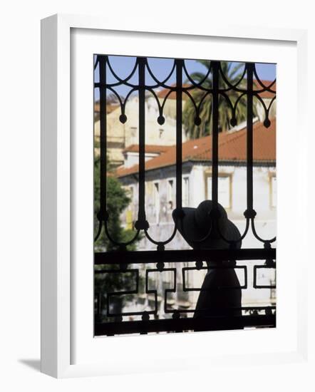 Tourist Gazes at Historic House through Iron Grillwork of Church, Lisbon, Portugal-Merrill Images-Framed Photographic Print