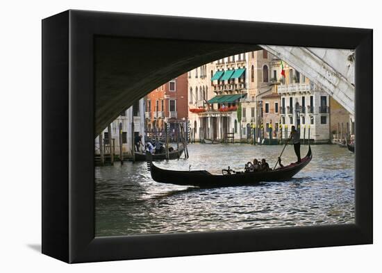 Tourist in a Gondola as They Pass under the Rialto Bridge, Venice, Italy-David Noyes-Framed Premier Image Canvas