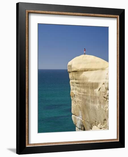 Tourist on Cliff Top at Tunnel Beach, Dunedin, South Island, New Zealand-David Wall-Framed Photographic Print