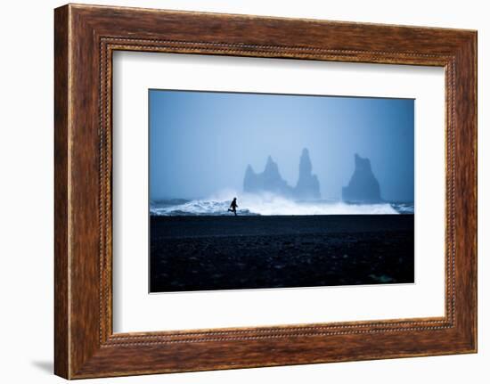 Tourist running on Black Sand Beach, Iceland, Polar Regions-John Alexander-Framed Photographic Print