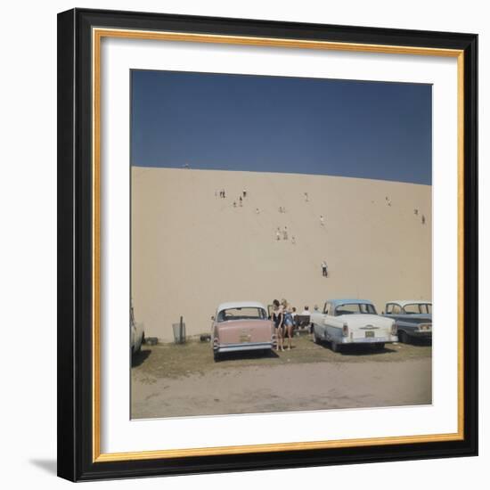 Tourists in Bathing Suits by Parked Cars and Climbing the Sleeping Bear Sand Dunes, Michigan, 1961-Frank Scherschel-Framed Photographic Print