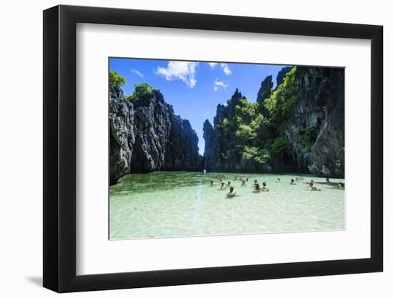 Tourists in the Hidden Bay with Clear Water in the Bacuit Archipelago, Palawan, Philippines-Michael Runkel-Framed Photographic Print