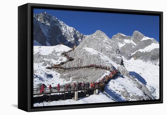 Tourists on Jade Dragon Snow Mountain (Yulong Xueshan), Lijiang, Yunnan, China, Asia-Ian Trower-Framed Premier Image Canvas