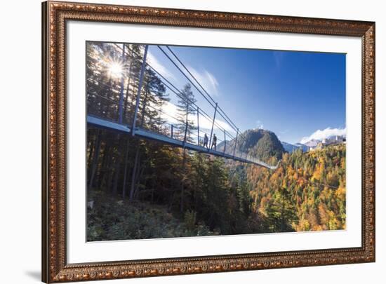 Tourists on the suspension bridge called Highline 179 framed by colorful woods in autumn, Ehrenberg-Roberto Moiola-Framed Photographic Print