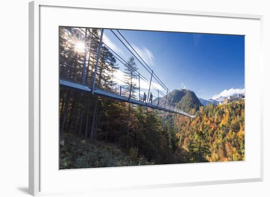 Tourists on the suspension bridge called Highline 179 framed by colorful woods in autumn, Ehrenberg-Roberto Moiola-Framed Photographic Print