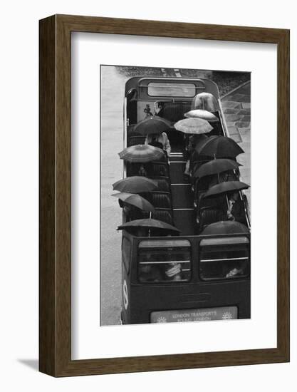 Tourists under Umbrellas on Open Top Bus, 1976-Kent Gavin-Framed Photographic Print