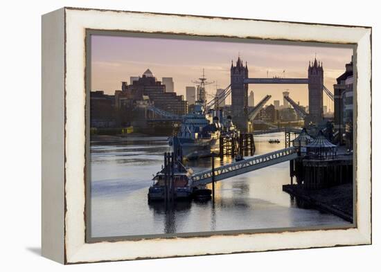 Tower Bridge raising deck with HMS Belfast on the River Thames, London, England, United Kingdom, Eu-Charles Bowman-Framed Premier Image Canvas