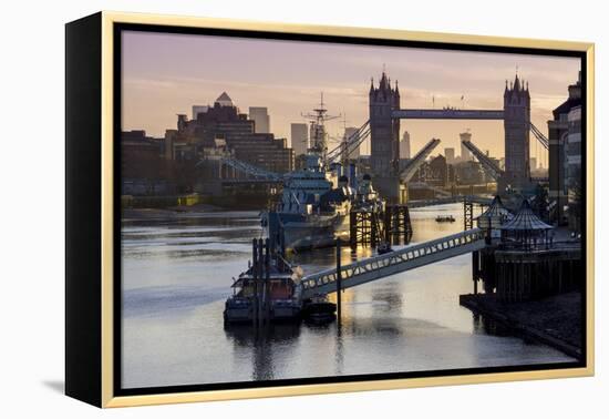 Tower Bridge raising deck with HMS Belfast on the River Thames, London, England, United Kingdom, Eu-Charles Bowman-Framed Premier Image Canvas