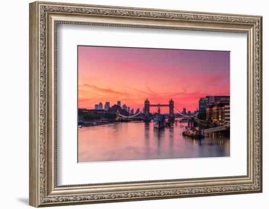 Tower Bridge, River Thames and HMS Belfast at sunrise with pink sky, and Canary Wharf-Ed Hasler-Framed Photographic Print