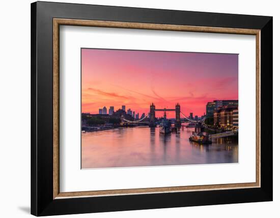 Tower Bridge, River Thames and HMS Belfast at sunrise with pink sky, and Canary Wharf-Ed Hasler-Framed Photographic Print