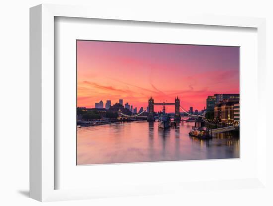 Tower Bridge, River Thames and HMS Belfast at sunrise with pink sky, and Canary Wharf-Ed Hasler-Framed Photographic Print